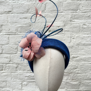 blue halo headpeice with silk abaca flowers and curled quils by isabella josie front view